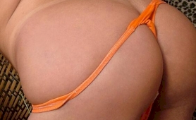 Big jugged brunette shemale camille strips orange bikini and shows her bubble ar