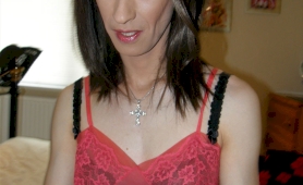 Sexy and slender crossdresser wearing pink negligee