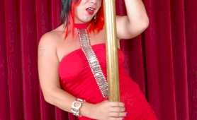 Tgirl in a red dress stripping