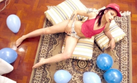 On the floor with balloons