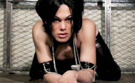 Brunette shemale foxi in latex and chains