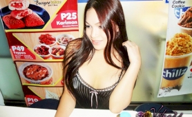 Very cute oriental coed showing her boobies at a convenience store