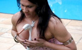 Busty shemale masturbating by the pool