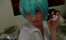 Young japanese newhalf in blue wig posing